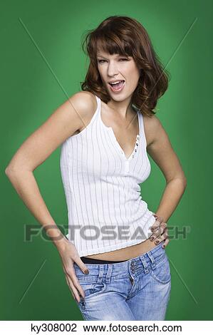 Young woman in tank top and jeans View Large Photo Image Stock Image - Young woman in tank top and jeans. Fotosearch