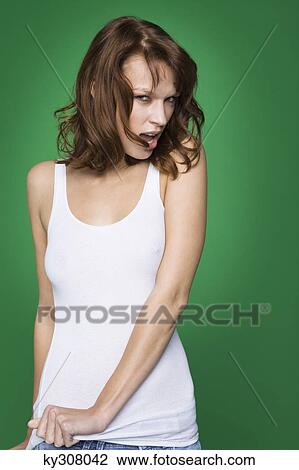Young woman in tank top and jeans View Large Photo Image Stock Image - Young woman in tank top and jeans. Fotosearch