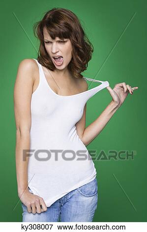 Stock Photo - Young woman in tank top and jeans. Fotosearch