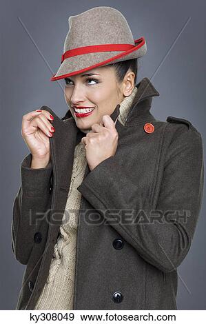Young woman wearing jacket and fedora View Large Photo Image Stock Photo - Young woman wearing jacket and fedora. Fotosearch
