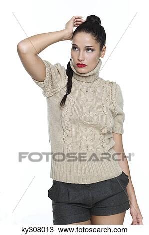 Young woman with hand in hair View Large Photo Image Stock Image - Young woman with hand in hair. Fotosearch