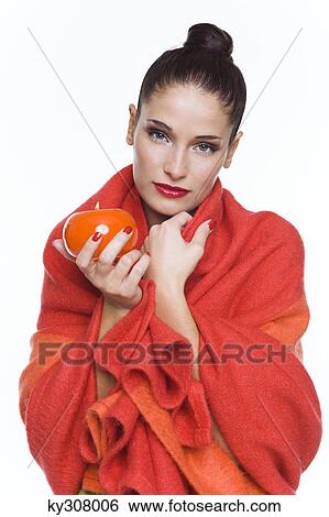 Young woman wrapped in blanket, holding candle View Large Photo Image Stock Photograph - Young woman wrapped in blanket, holding candle. Fotosearch