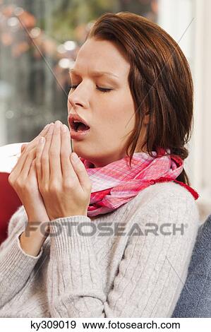 Young woman coughing View Large Photo Image Stock Photo - Young woman coughing. Fotosearch