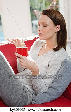 Young woman drinking coffee View Large Photo Image Stock Photography - Young woman drinking coffee. Fotosearch