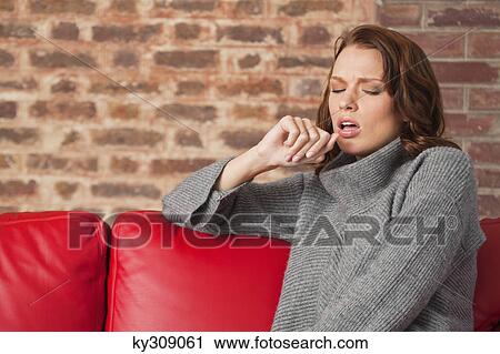 Young woman looking tired View Large Photo Image Stock Image - Young woman looking tired. Fotosearch