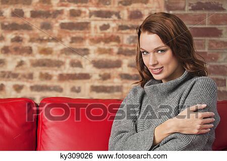 Young woman smiling at camera View Large Photo Image Stock Photograph - Young woman smiling at camera. Fotosearch