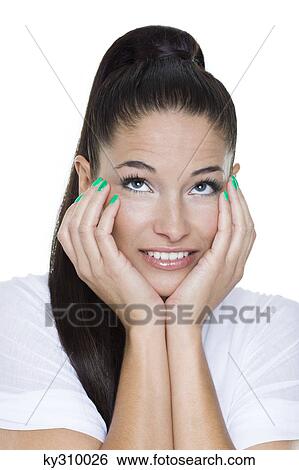 Portrait of young woman with hands on chin View Large Photo Image Stock Photograph - Portrait of young woman with hands on chin. Fotosearch
