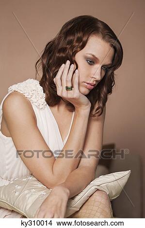 Picture - Young woman day dreaming. Fotosearch