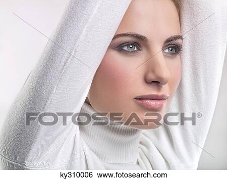 Stock Photograph - Young woman day dreaming. Fotosearch