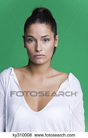 Young woman looking at camera View Large Photo Image Stock Photo - Young woman looking at camera. Fotosearch