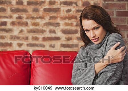 Stock Photo - Young woman looking down. Fotosearch