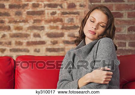 Stock Photo - Young woman resting with eyes closed. Fotosearch