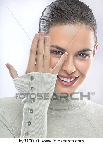 Young woman showing fingers View Large Photo Image Stock Image - Young woman showing fingers. Fotosearch