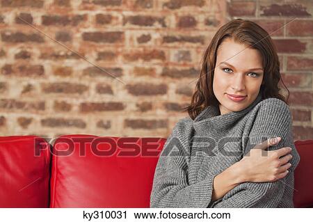 Young woman smiling at camera View Large Photo Image Stock Image - Young woman smiling at camera. Fotosearch