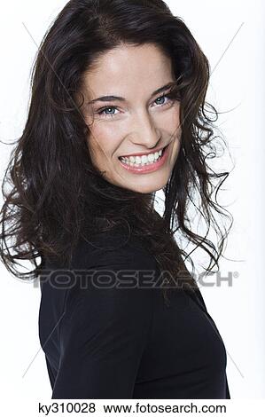 Young woman smiling at camera View Large Photo Image Stock Photo - Young woman smiling at camera. Fotosearch