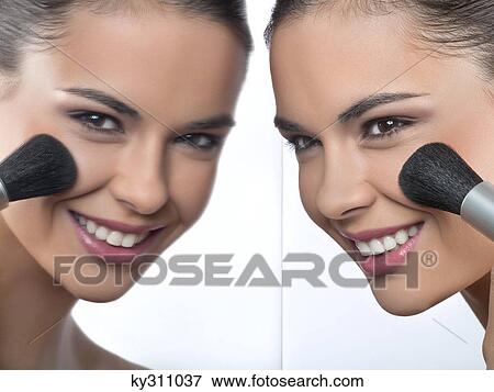 Young woman applying blush and her reflection in mirror View Large Photo Image Stock Photo - Young woman applying blush and her reflection in mirror. Fotosearch