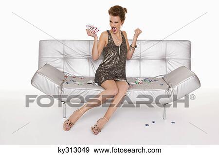 Young happy woman in formalwear holding cards View Large Photo Image Stock Photo - Young happy woman in formalwear holding cards. Fotosearch