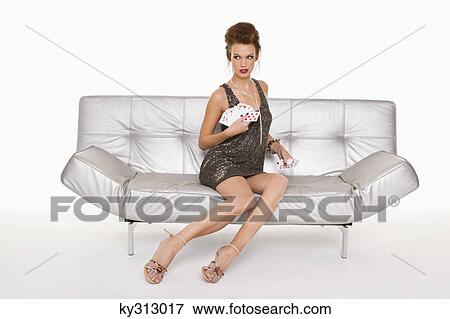 Young woman in formalwear holding cards View Large Photo Image Stock Photo - Young woman in formalwear holding cards. Fotosearch