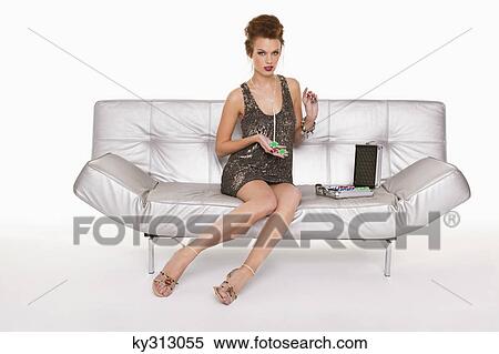 Young woman in formalwear holding gambling chips View Large Photo Image Stock Photography - Young woman in formalwear holding gambling chips. Fotosearch
