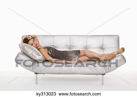 Young woman in formalwear sleeping on sofa View Large Photo Image Stock Image - Young woman in formalwear sleeping on sofa. Fotosearch