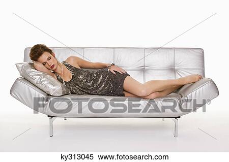 Young woman in formalwear sleeping on sofa View Large Photo Image Stock Photography - Young woman in formalwear sleeping on sofa. Fotosearch