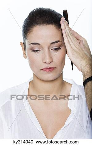 Young woman getting her hair done View Large Photo Image Stock Image - Young woman getting her hair done. Fotosearch