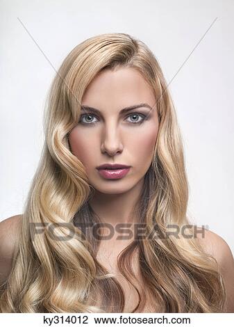 Young woman looking at camera View Large Photo Image Stock Image - Young woman looking at camera. Fotosearch
