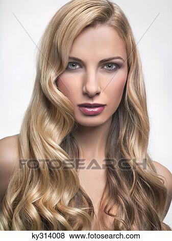 Stock Photo - Young woman looking at camera. Fotosearch