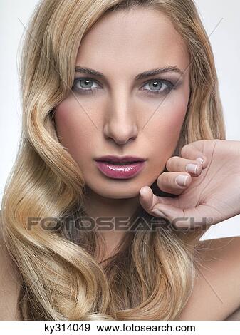 Young woman looking at camera View Large Photo Image Stock Photo - Young woman looking at camera. Fotosearch