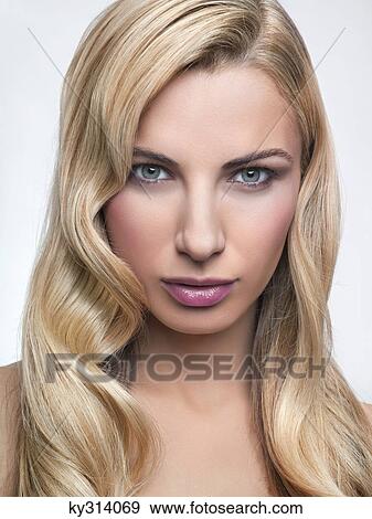 Stock Photo - Young woman looking at camera. Fotosearch