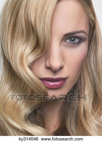 Young woman looking at camera View Large Photo Image Stock Photograph - Young woman looking at camera. Fotosearch