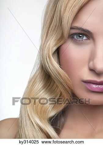 Young woman looking at camera View Large Photo Image Stock Photography - Young woman looking at camera. Fotosearch