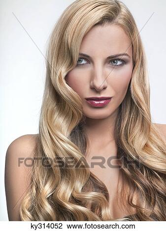 Stock Image - Young woman looking away. Fotosearch