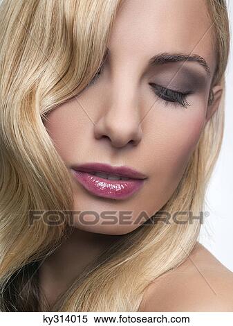 Stock Photography - Young woman with eyes closed. Fotosearch
