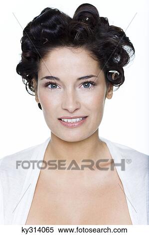 Stock Photography - Young woman with hair clips. Fotosearch
