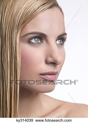 Young woman with wet hair, looking away View Large Photo Image Stock Photo - Young woman with wet hair, looking away. Fotosearch