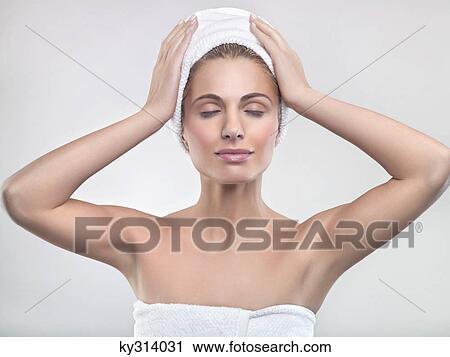 Young woman wrapped in towels View Large Photo Image Stock Image - Young woman wrapped in towels. Fotosearch