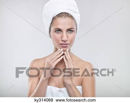 Young woman wrapped in towels View Large Photo Image Stock Photo - Young woman wrapped in towels. Fotosearch
