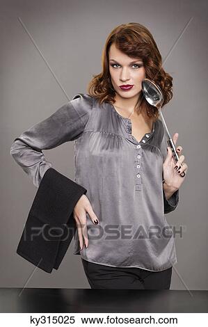 Young woman holding spoon and napkin View Large Photo Image Stock Photography - Young woman holding spoon and napkin. Fotosearch