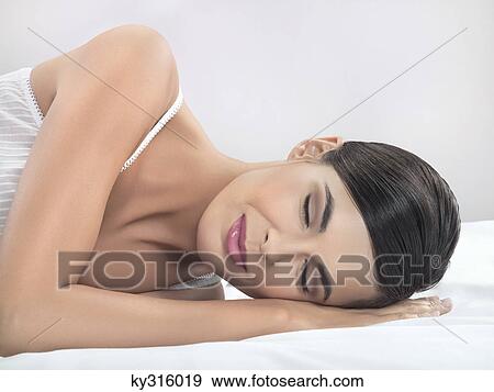 Young woman resting View Large Photo Image Stock Photo - Young woman resting. Fotosearch