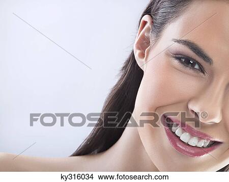 Young woman smiling for camera View Large Photo Image Picture - Young woman smiling for camera. Fotosearch
