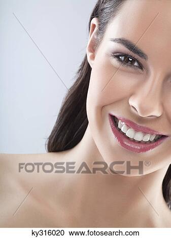 Young woman smiling for camera View Large Photo Image Stock Image - Young woman smiling for camera. Fotosearch