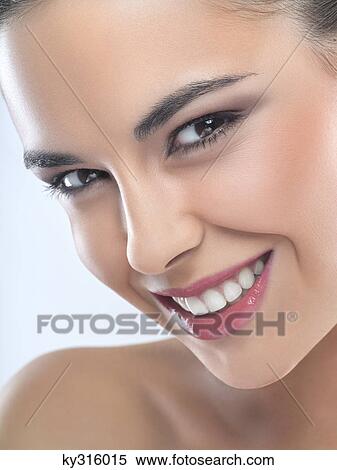Young woman smiling for camera View Large Photo Image Stock Photography - Young woman smiling for camera. Fotosearch