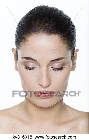 Stock Photo - Young woman with eyes closed. Fotosearch