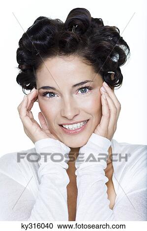 Young woman with hair clips View Large Photo Image Stock Image - Young woman with hair clips. Fotosearch