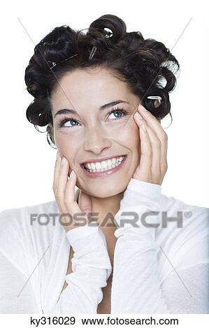 Young woman with hair clips View Large Photo Image Stock Photo - Young woman with hair clips. Fotosearch