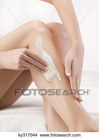 Woman shaving her leg View Large Photo Image Picture - Woman shaving her leg. Fotosearch