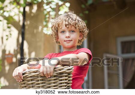 Boy holding basket of apples View Large Photo Image Stock Image - Boy holding basket of apples. Fotosearch