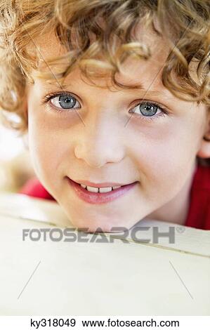 Close-up of a boy smiling View Large Photo Image Stock Photo - Close-up of a boy smiling. Fotosearch