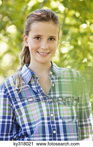 Portrait of a smiling girl View Large Photo Image Stock Image - Portrait of a smiling girl . Fotosearch